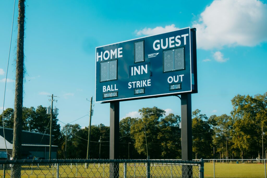 An empty scoreboard on a baseball field.